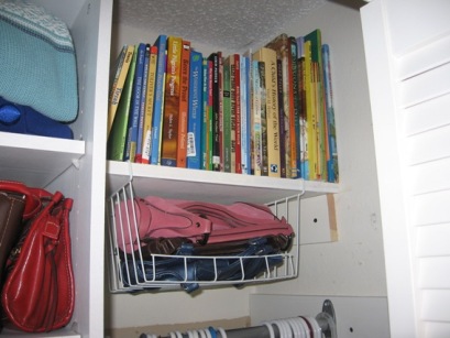 Books we aren't currently using are &quot;hidden&quot; in the top of my closet.